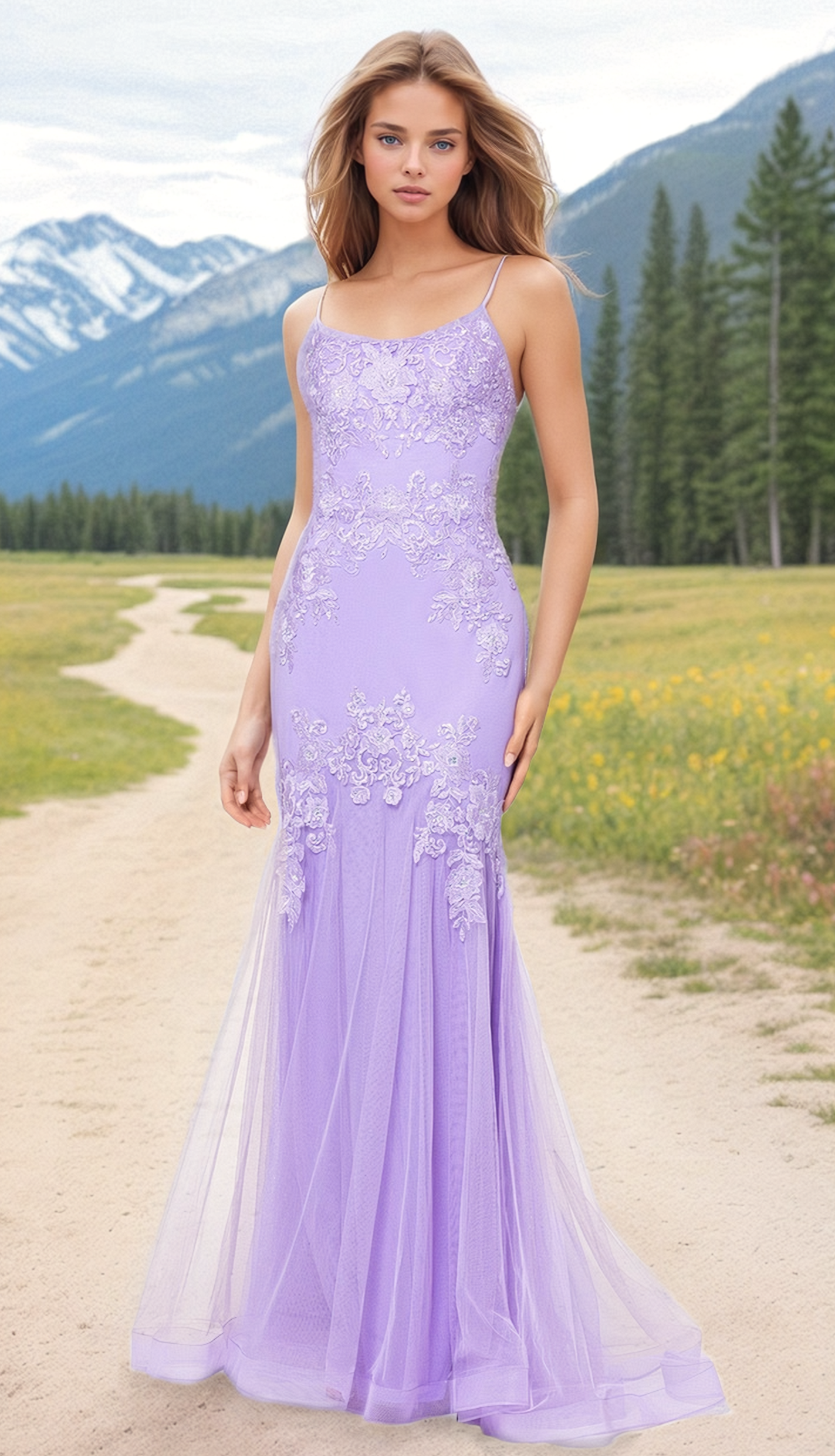 A woman in the Blondie Nites Lilac Purple Long Prom Dress 4706BN stands on a dirt path, framed by mountains, pine trees, and wildflowers. The fitted lace-up gown adds elegance to the scenic natural backdrop.